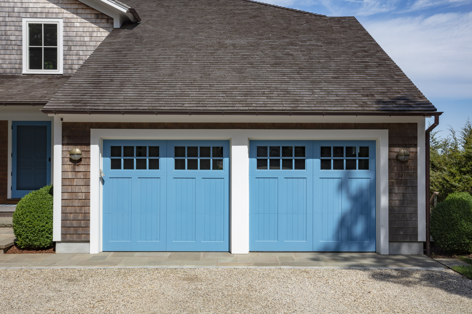 Water Hole blue door welcomes you. Build by Bruce Helier Builders.