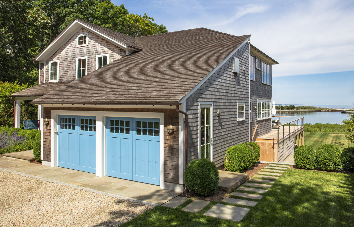 Water Hole blue door welcomes you. Build by Bruce Helier Builders.