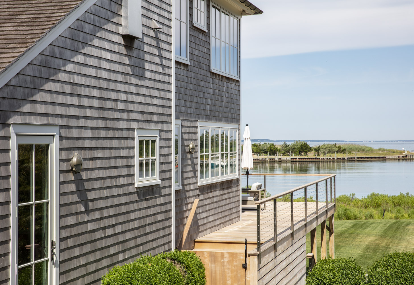 Water Hole blue door welcomes you. Build by Bruce Helier Builders.